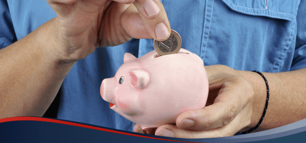 Person putting a coin a piggy bank, depicting micro savings and the use of the Micro Savings app in the Philippines