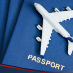 Photo of a passport and a mini airplane