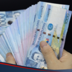 Photo of peso bills being counted to illustrate sending money to banks from a Cebuana Lhuillier branch