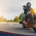 Photo of a man, riding a motorcycle