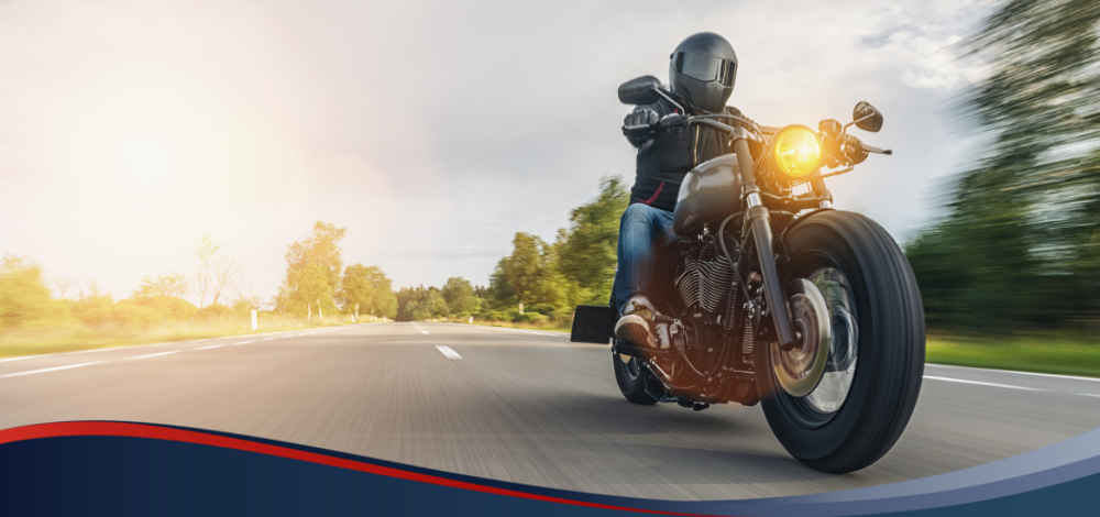 Photo of a man, riding a motorcycle